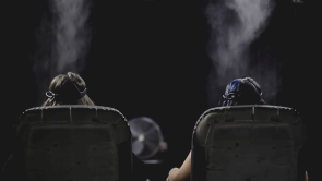 XYZ-Technologies_cadabra_Lodha-Group_Palava9D-experience-two-people-sited-on-d-box-chairs-with-VR-headsets-from-behind-with-misting-devices-activated