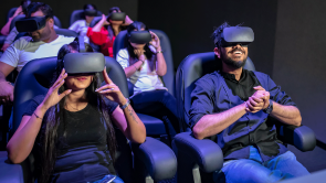 XYZ-Technologies_cadabra_Lodha-Group_Palava9D-experience-woman-and-men-sitted-on-d-box-chairs-with-VR-headsets