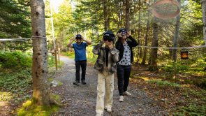 XYZ-Technologies_ParcDuBourg-family wearing-AR-headsets-observe-floating sieve-daytime- forest-trail