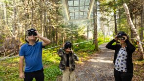 XYZ-Technologies_ParcDuBourgDePabos_family-wearing-AR-headsets-observe-a-glass-window-floating-forest-trail