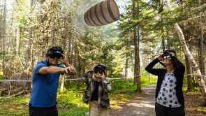 XYZ-Technologies_ParcDuBourgDePabos_family-wearing-AR-headsets-observe_wooden-barrel-forest-trail-daytime