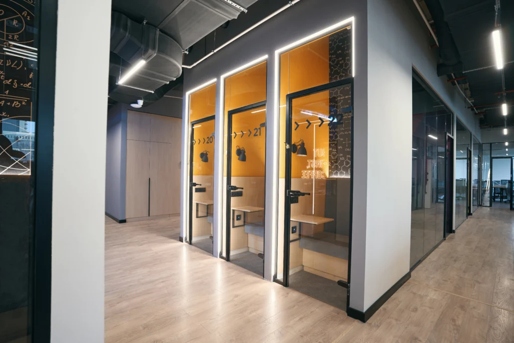 Coworking phone booth with acoustic isolation and AV equipment