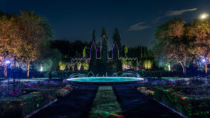 XYZ Technologies MJAL summer luminous nighttime experience overview of garden with lasers drawing castle